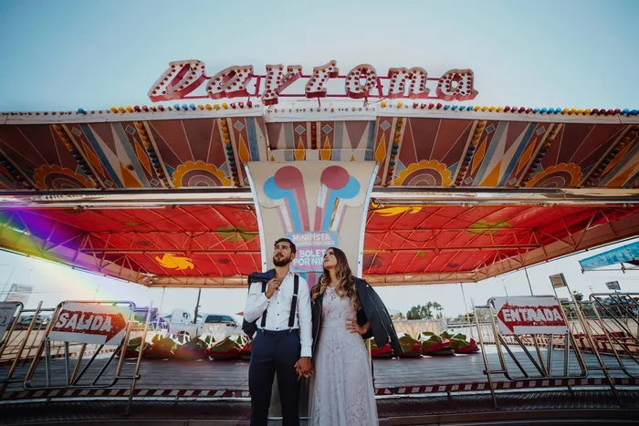 A couple posing in a festival