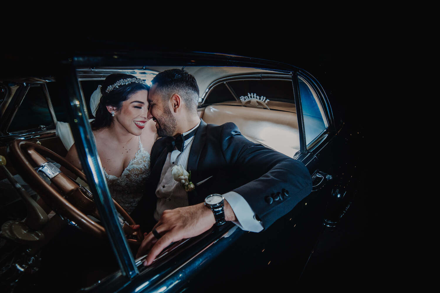 A couple looking at each other with love in a car