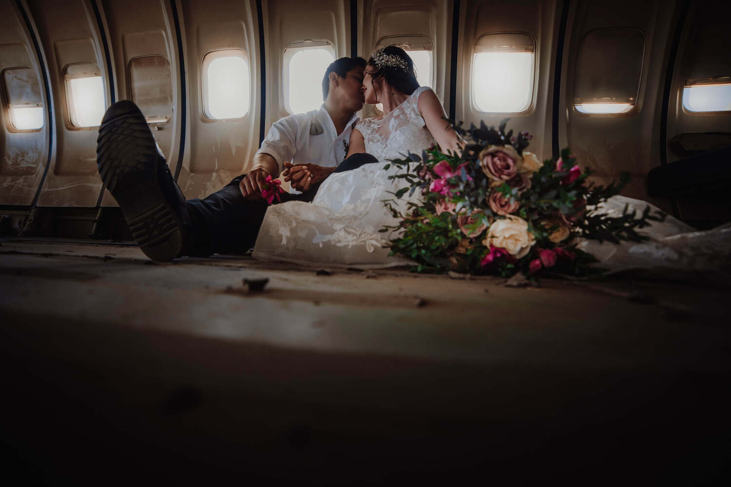 A couple kissing in a crashed airplane